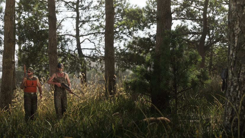 Armed people in the forest, official screenshot.
